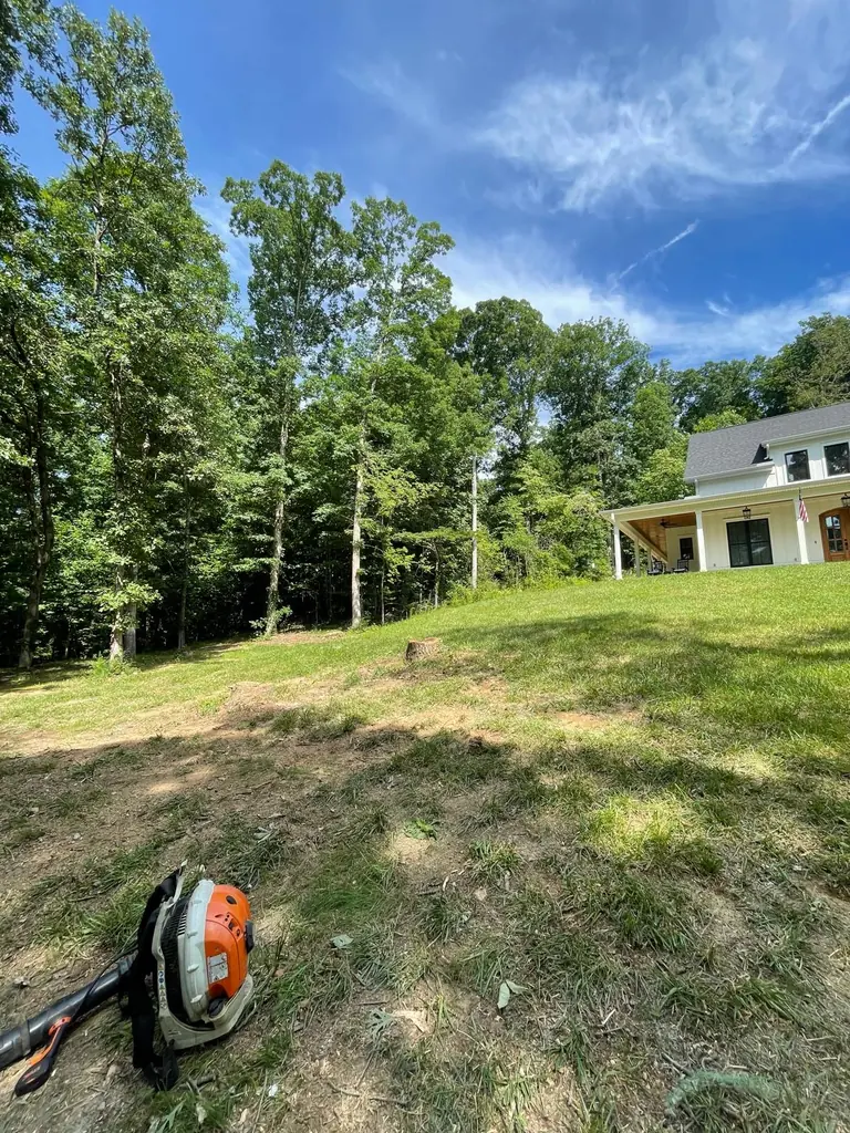 Backpack blower on the lawn during final site cleanup in Knoxville, Tennessee