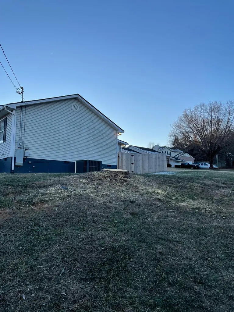 Cleared lot beside a white house in Knoxville, Tennessee