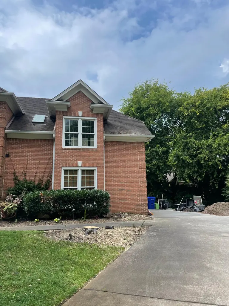 Job site set up on the driveway of a brick home in Knoxville, Tennessee